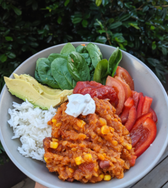 Mexican Bowl with lentil chilli rice avocado spinach tomato and capsicum